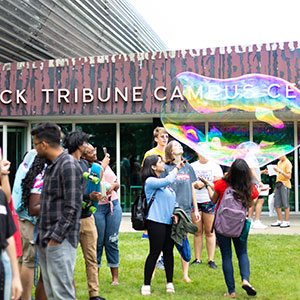Students playing with bubbles outside. Links to Gifts by Will will.jpg