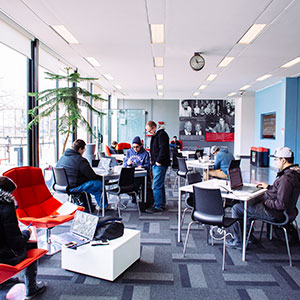Students studying in a lounge area. Links to Gifts of Appreciated Securities securities.jpg